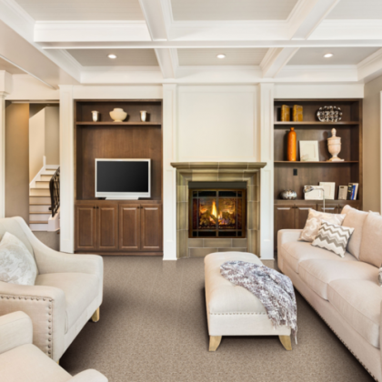 A living room with a fireplace and a flat screen tv