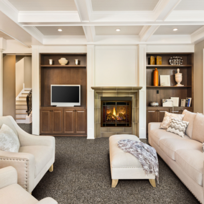 A living room with a fireplace and a flat screen tv
