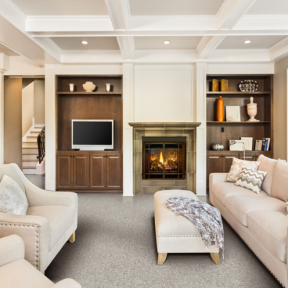 A living room with a fireplace and a flat screen tv