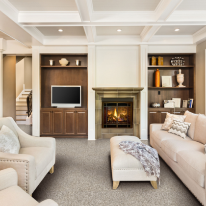 A living room with a fireplace and a flat screen tv
