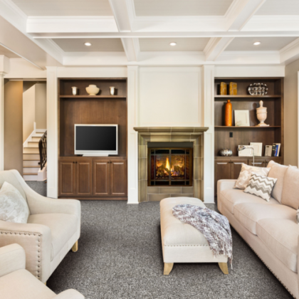 A living room with a fireplace and a flat screen tv