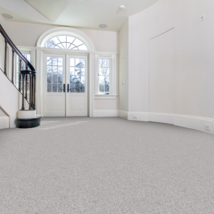 An empty room with a staircase and a door