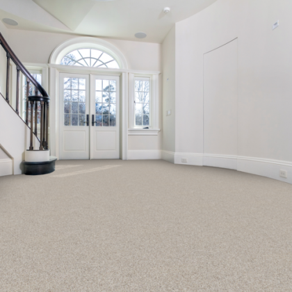 An empty room with a staircase and a window