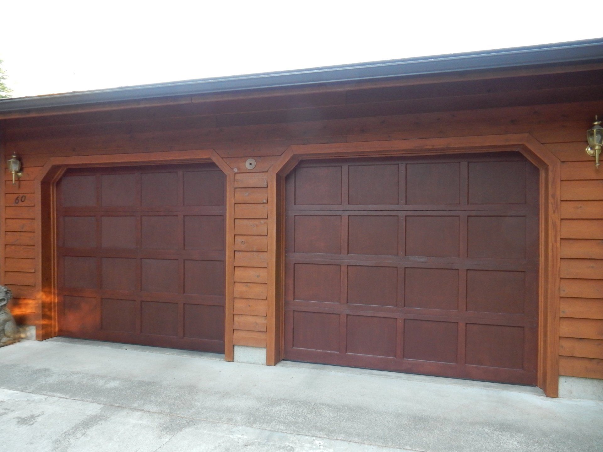 Garage with wood siding