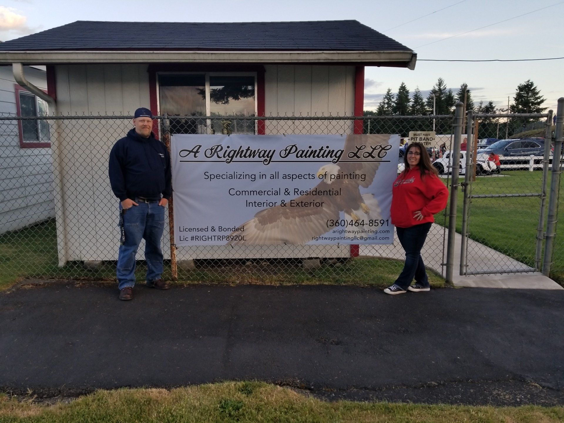 A Rightway Painting LLC tarp sign