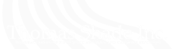 a white background with a few lines on it. Logo for Thomas Shade Inc.