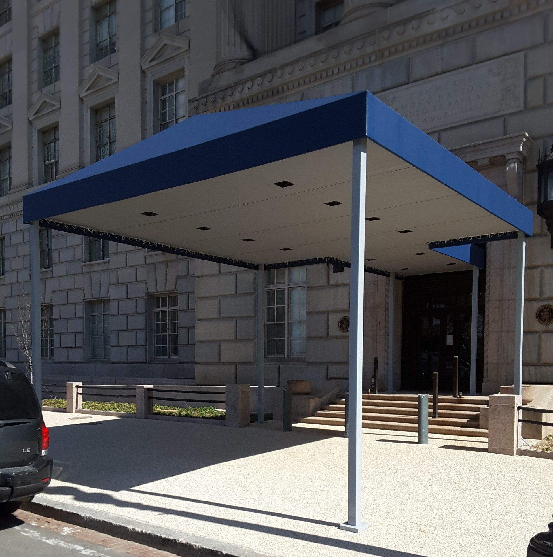 A blue awning over the entrance of a building.