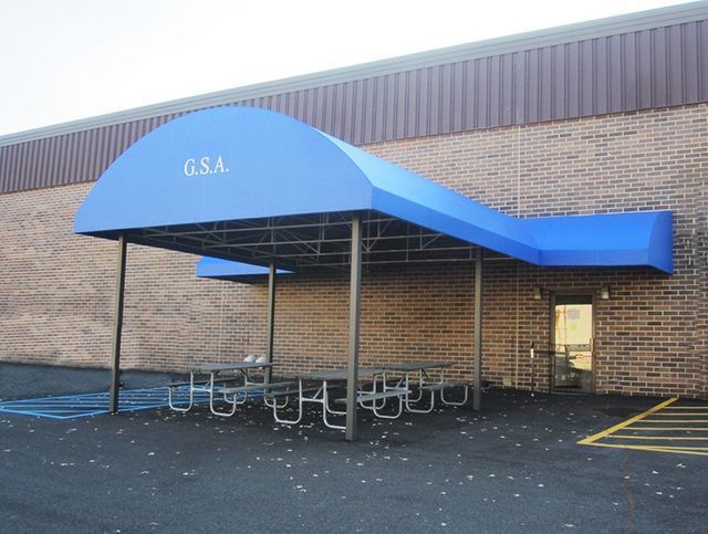 A blue awning with the number GS4 on it.