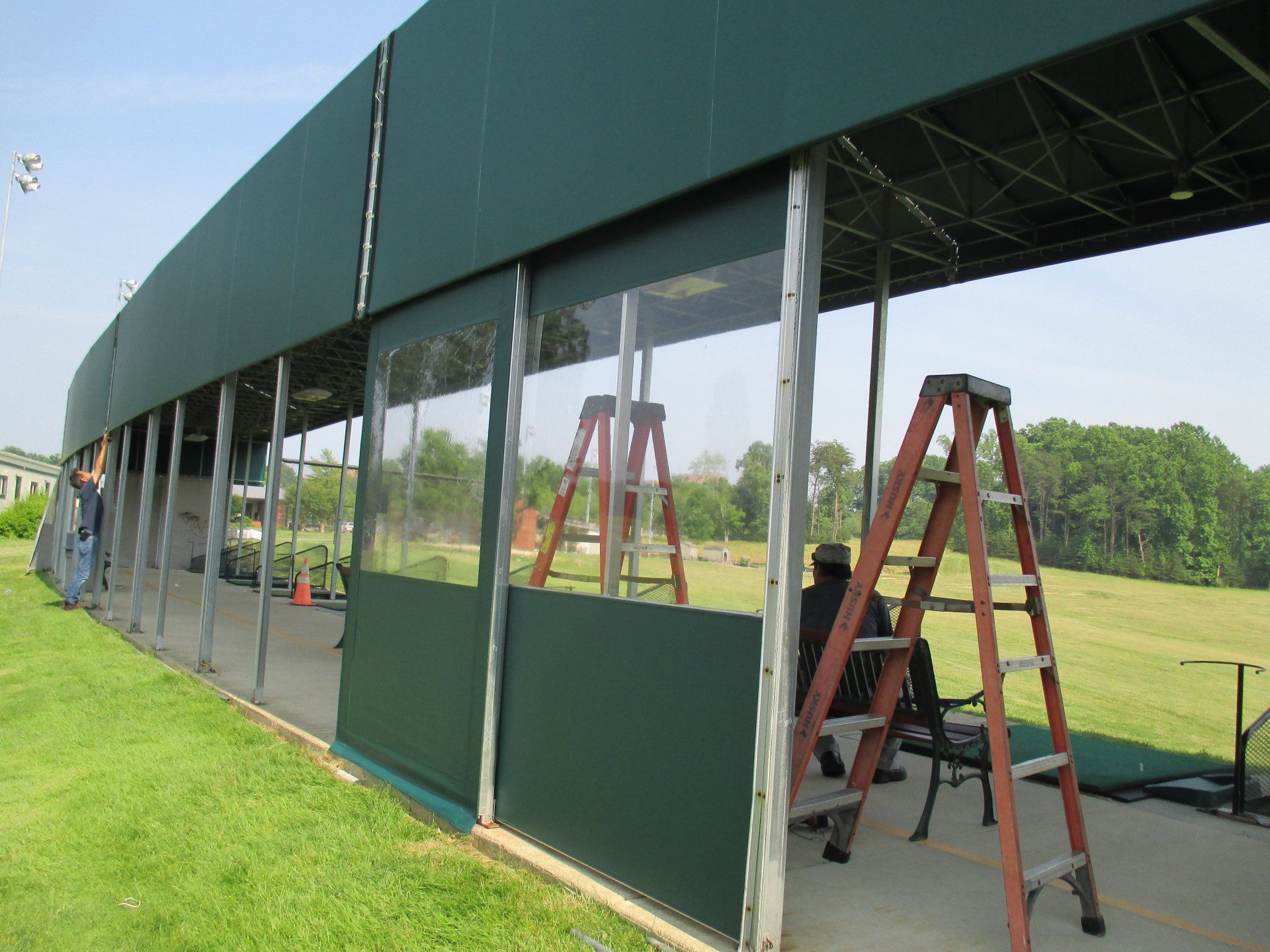 A ladder is sitting on the side of a building.