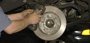 Mechanic checking brake