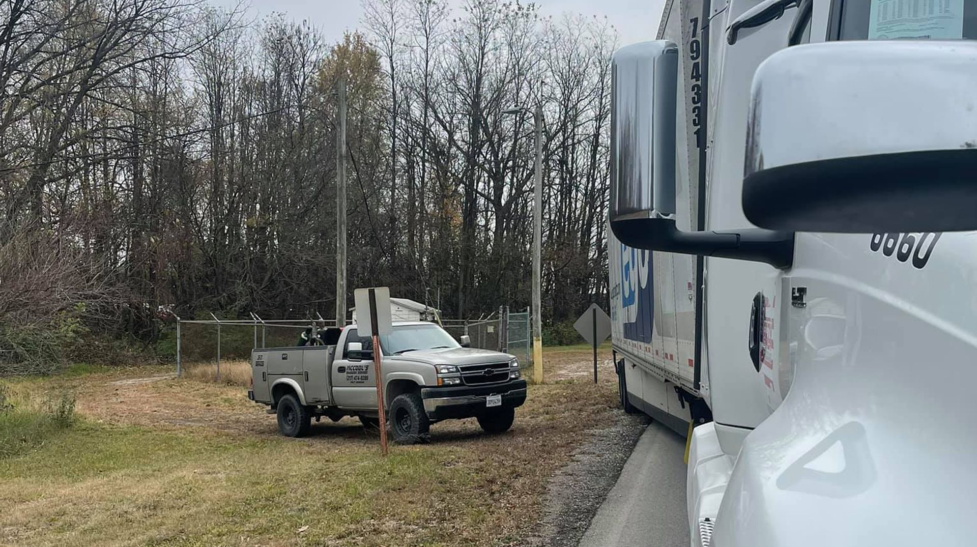 McCool Semi Repair & Roadside Services' white service gray pickup and a huge white truck