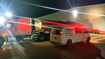 McCool Semi Repair & Roadside Services' white service van and a tanker truck