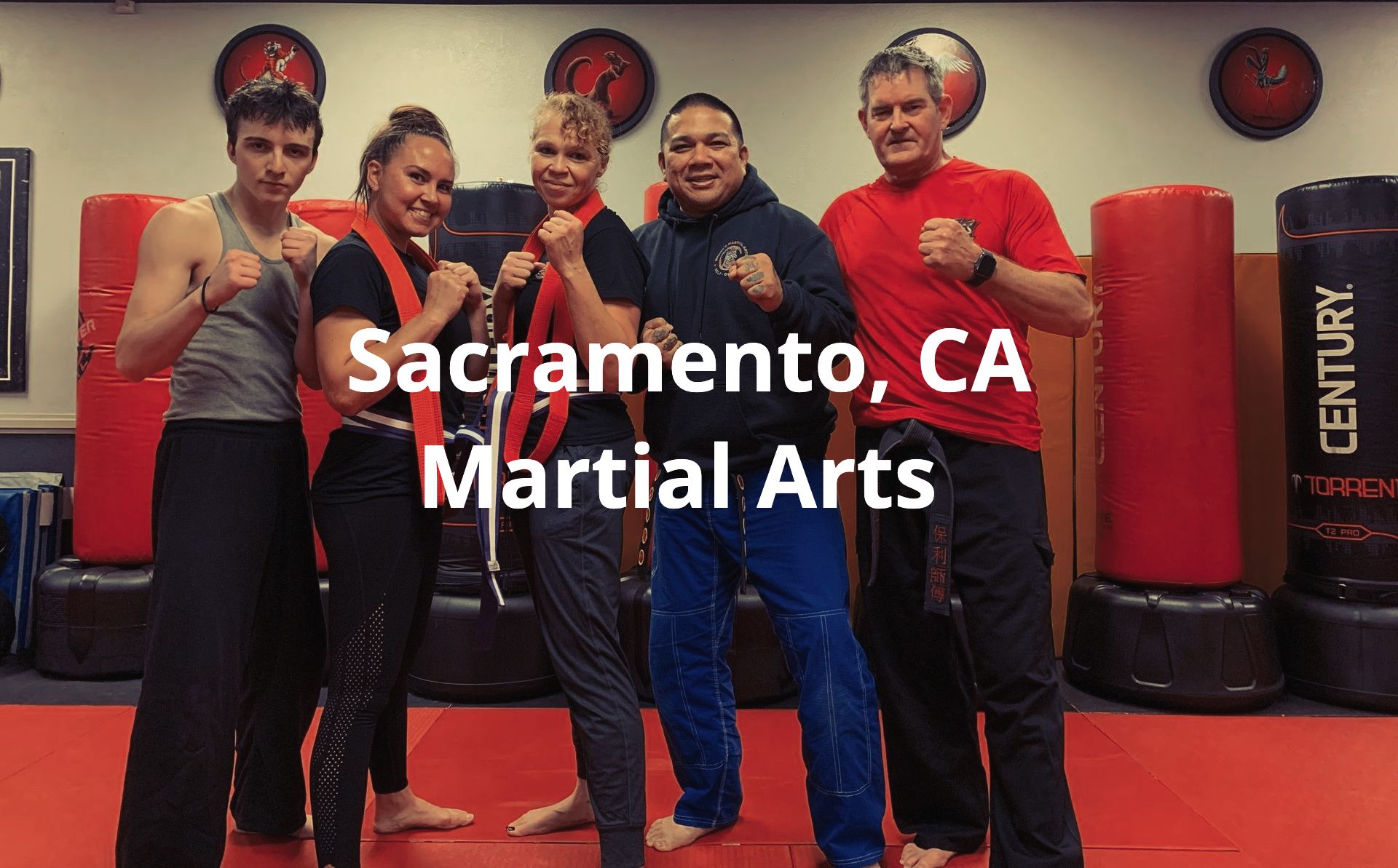 Group of instructors in fighting stance at Moore's Martial Arts Sacramento after a Shou Shu class.