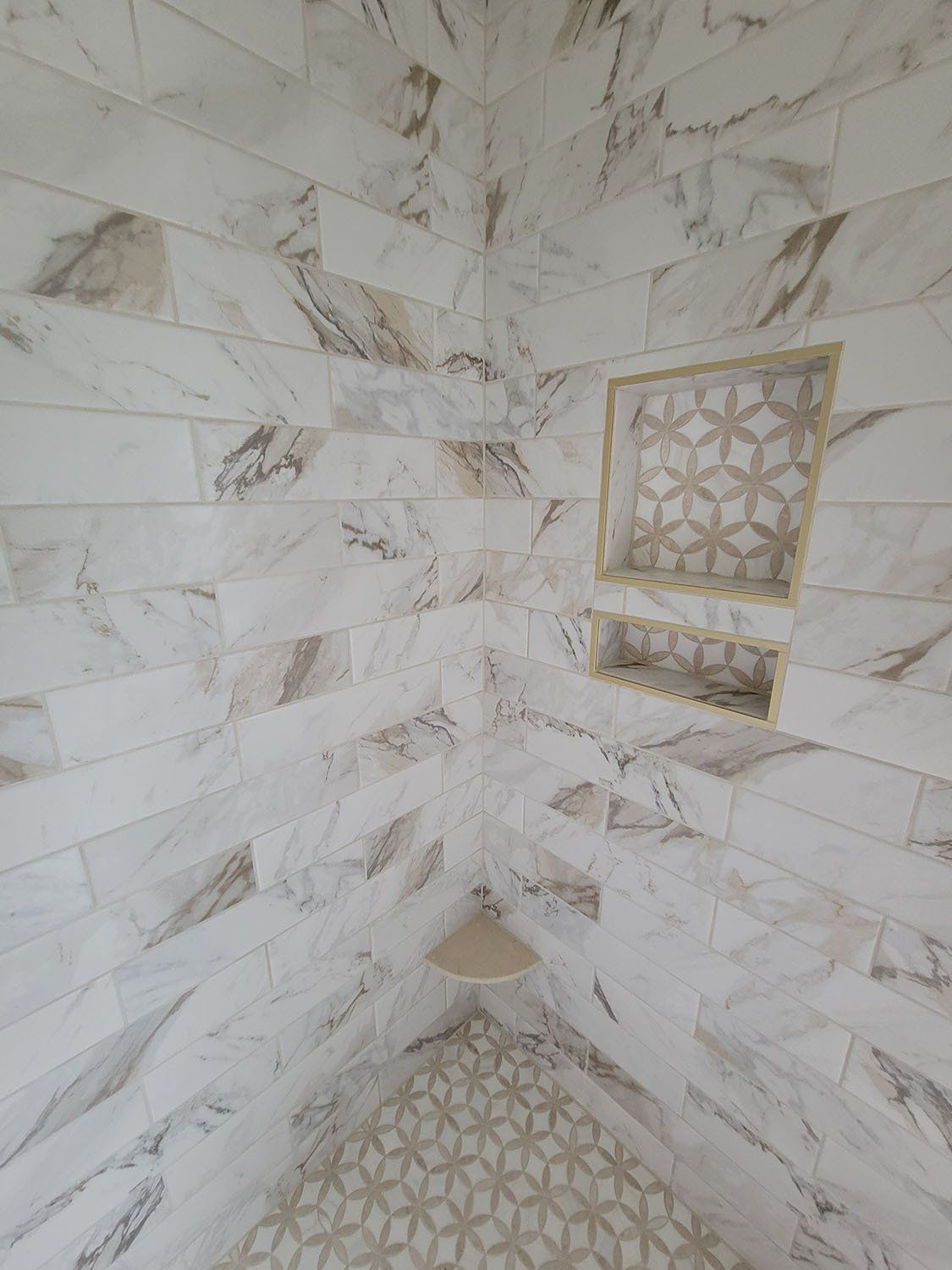 Decorative tile design added to a bathroom wall