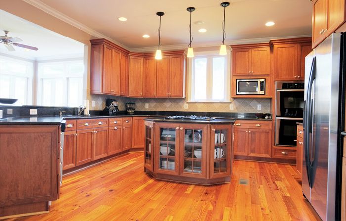 Spacious kitchen with custom wood cabinets