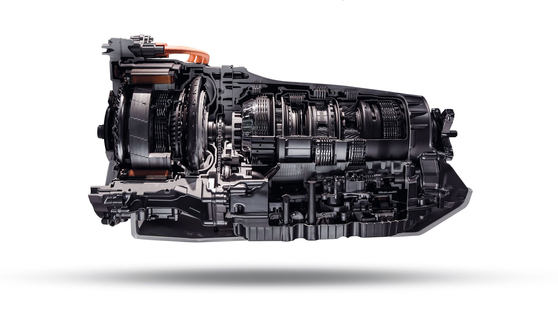 Cutaway view of a complex black mechanical engine or transmission assembly on a white background