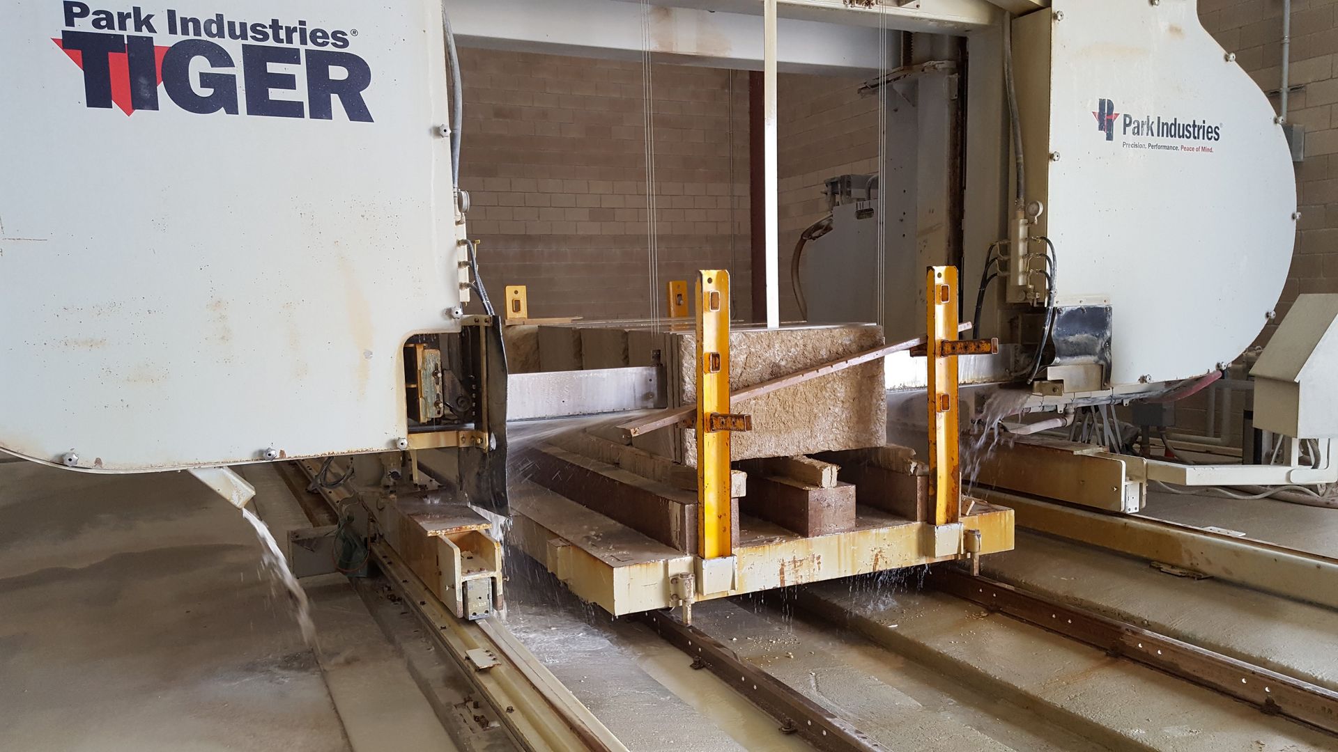 A park industries tiger machine is cutting a piece of wood