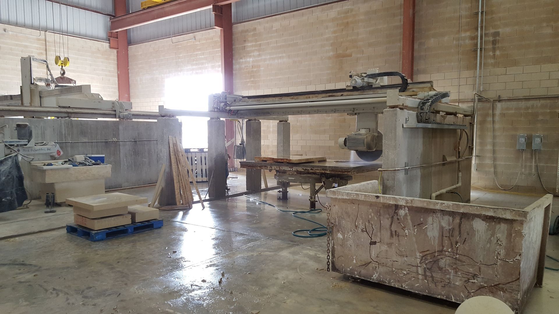 A large warehouse with a lot of machinery in it