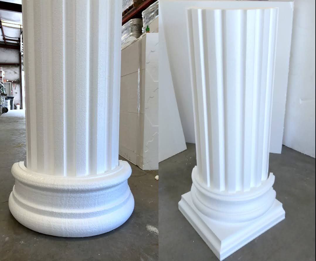 Two white columns are sitting next to each other in a room.