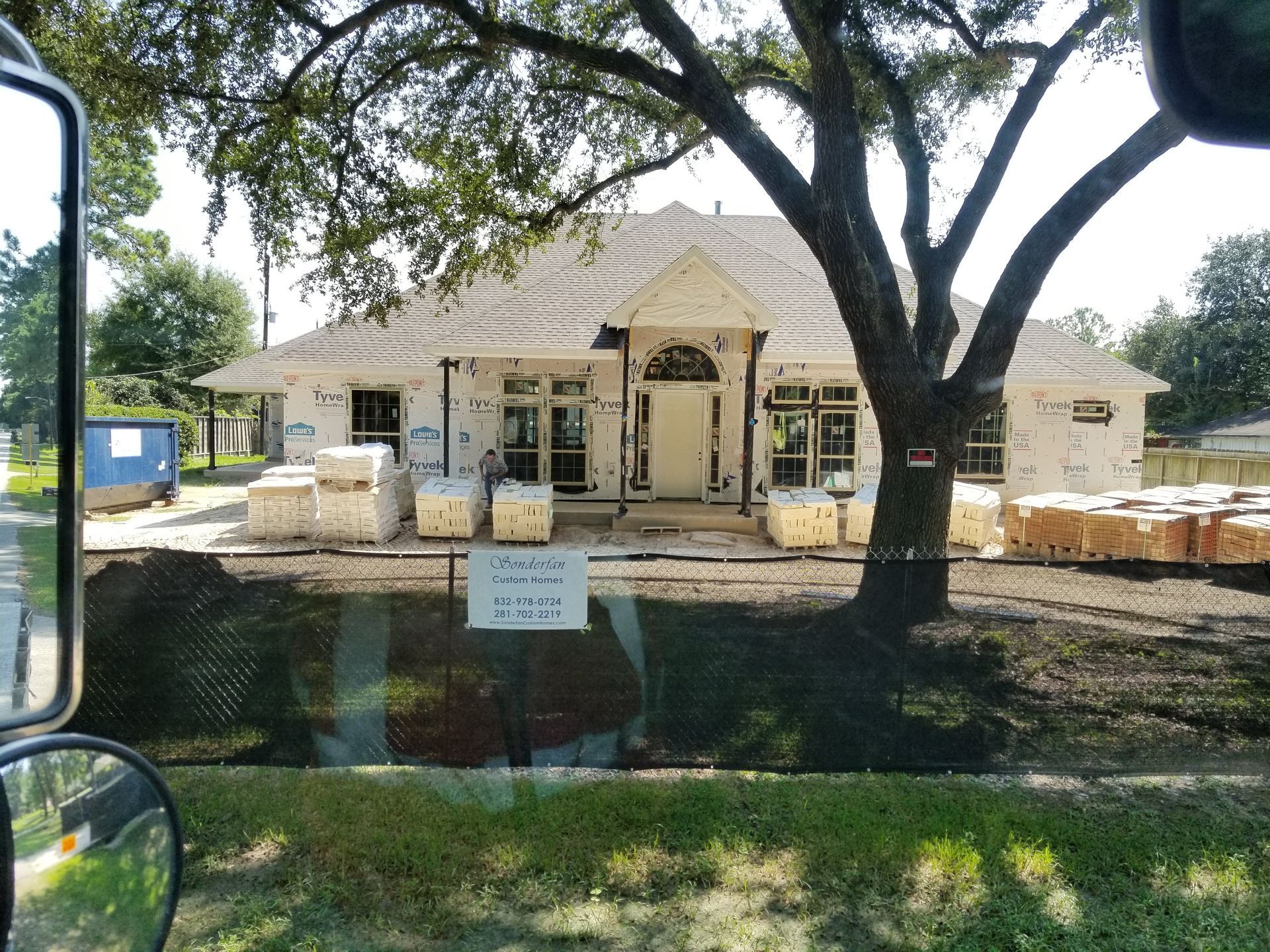 A house that is being built with a lot of bricks