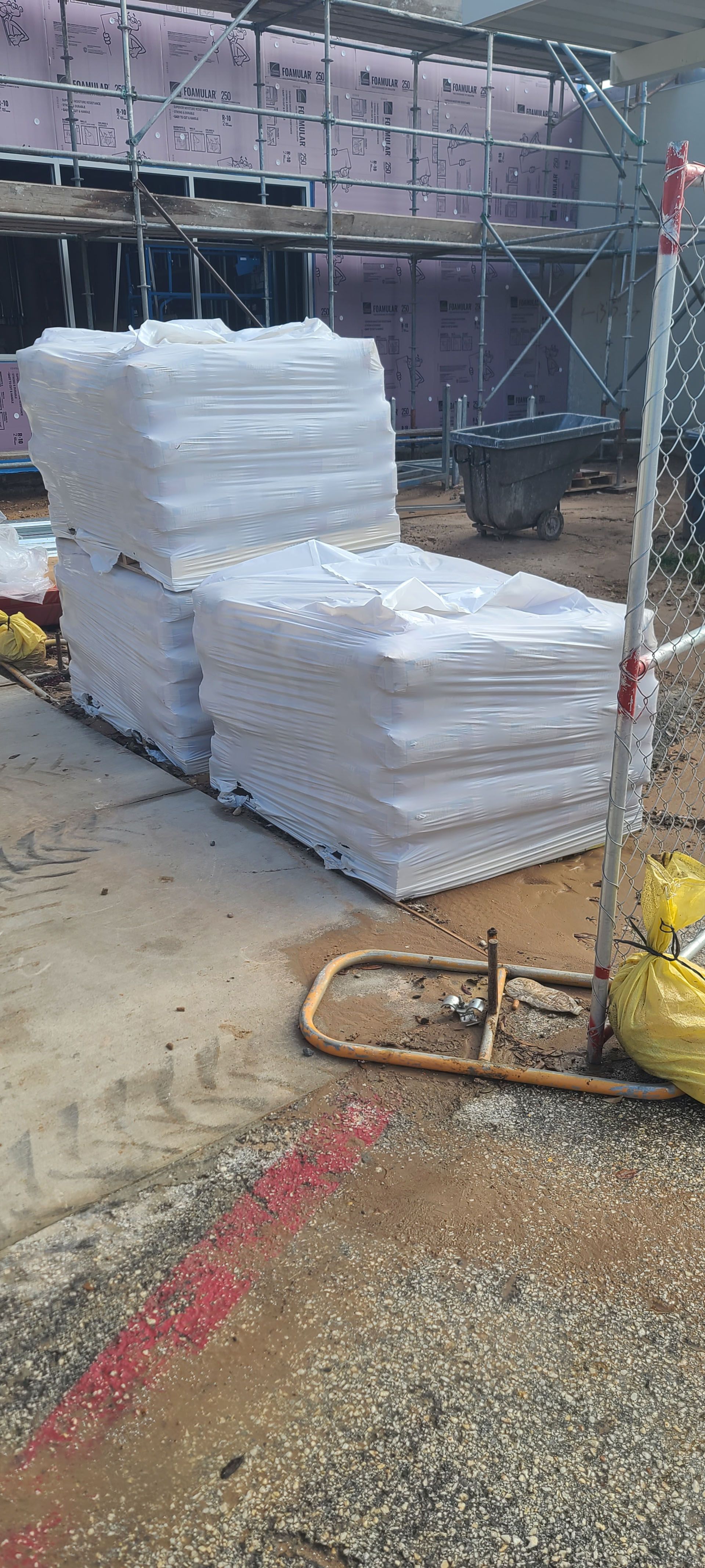 A stack of styrofoam blocks sitting on top of each other on a construction site.