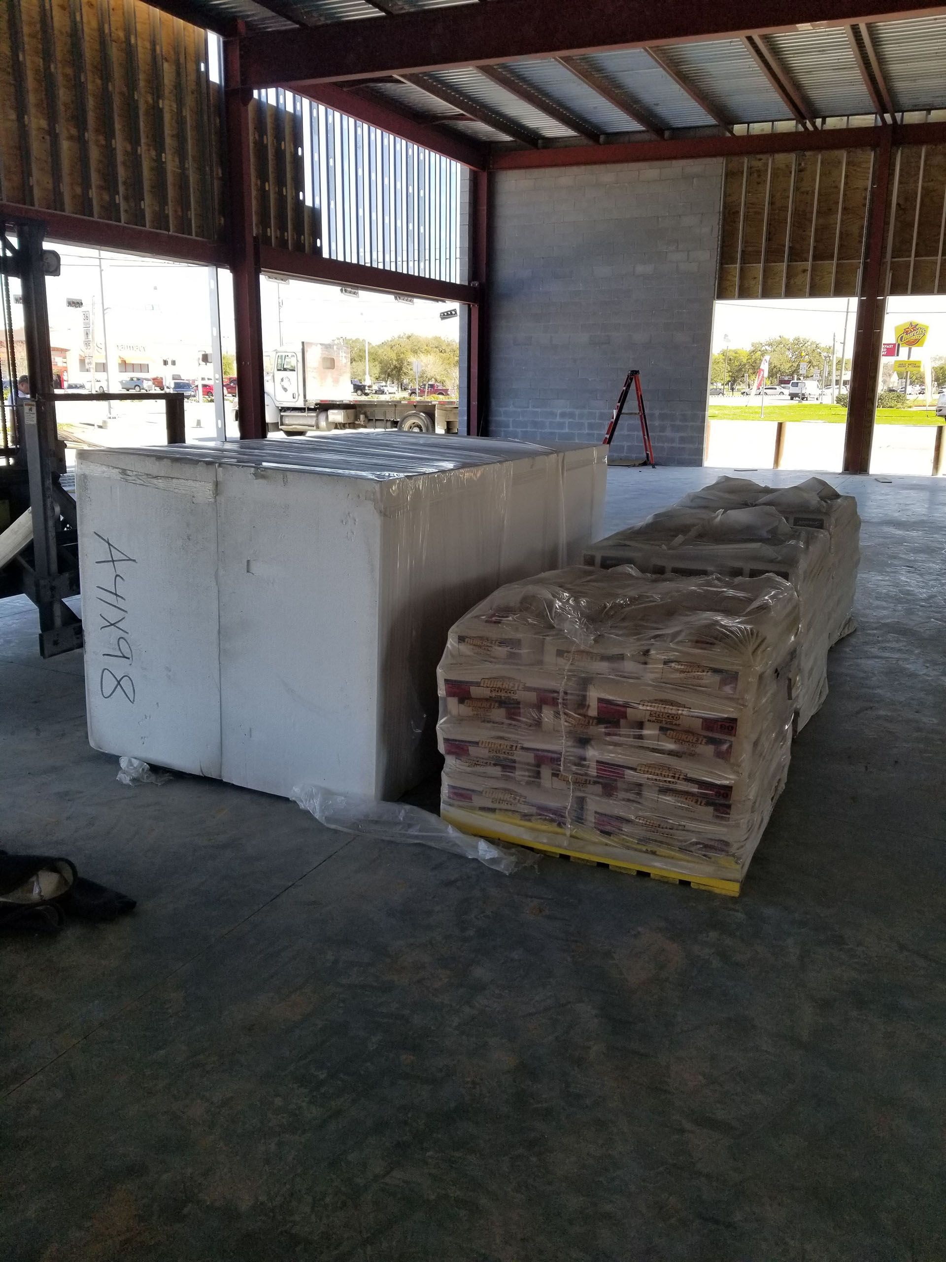 A warehouse filled with lots of boxes and pallets