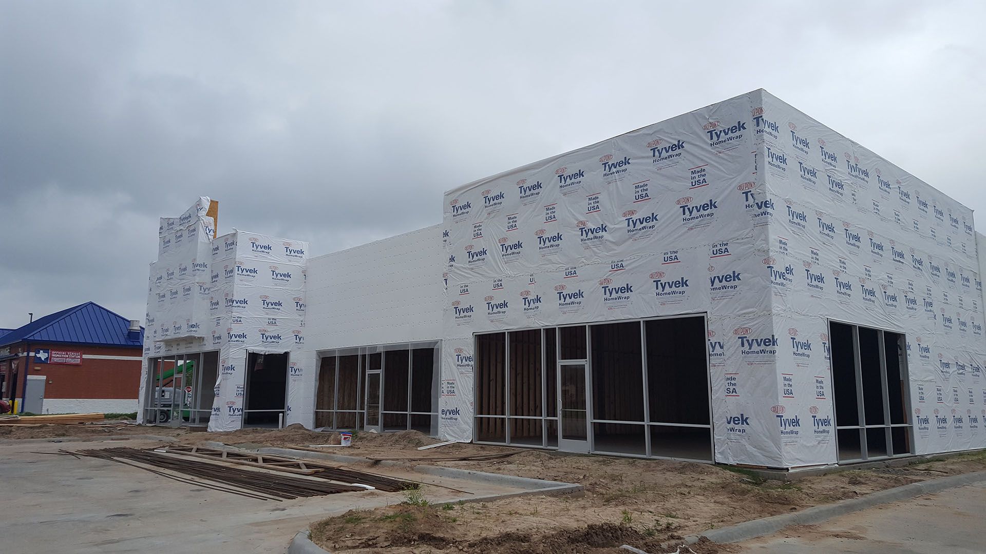 A large building is being built with a lot of windows.