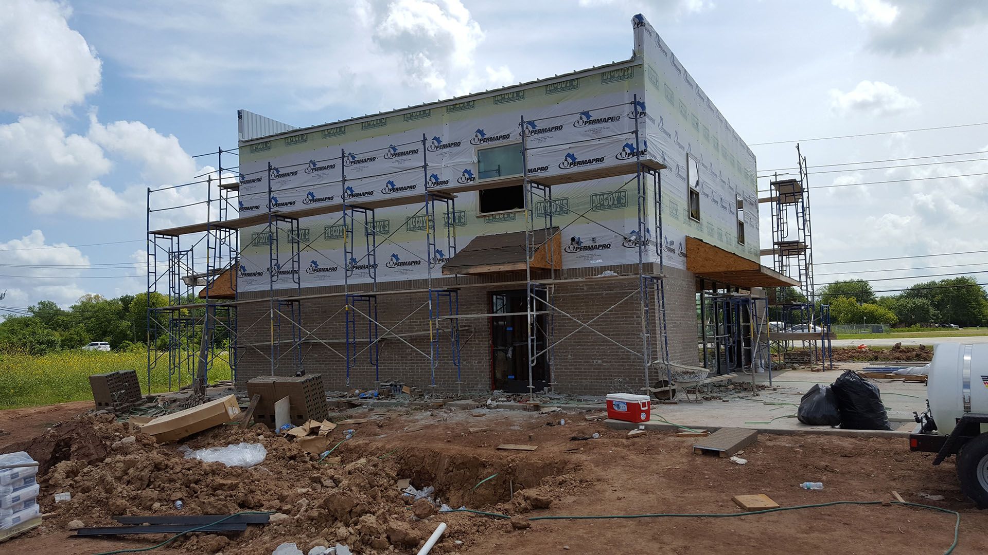 A building is being built with scaffolding around it.