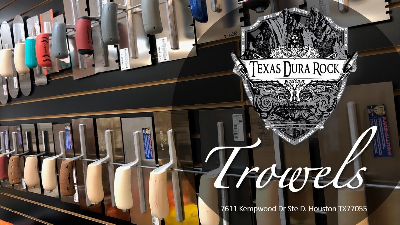 Texas dura rock shovels are displayed on a wall