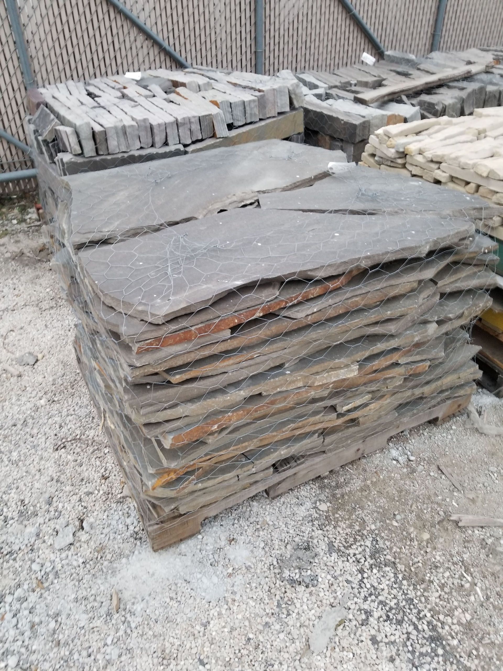A pile of rocks is sitting on top of a wooden pallet.