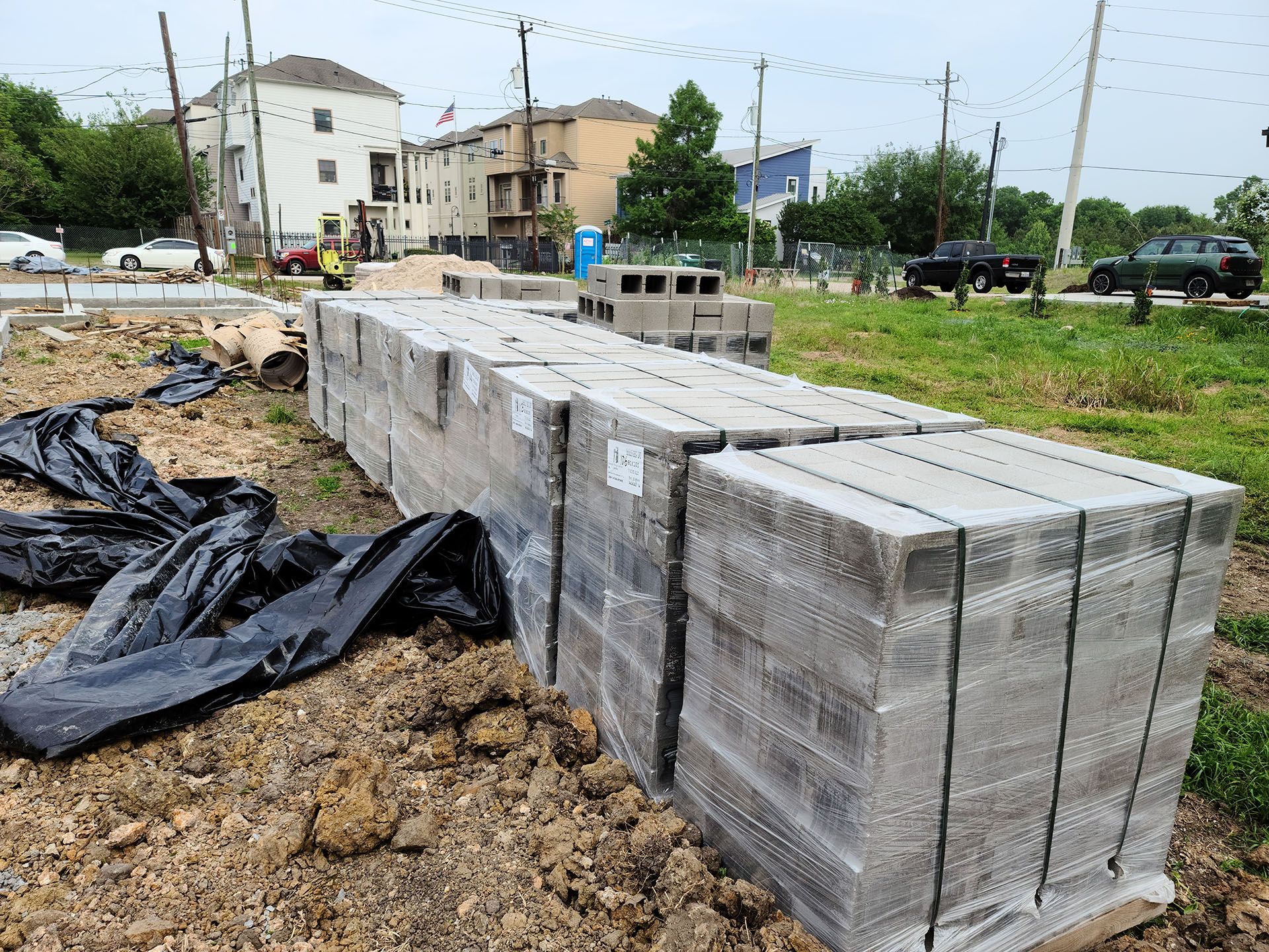 A pile of concrete blocks sitting on top of a pile of dirt.