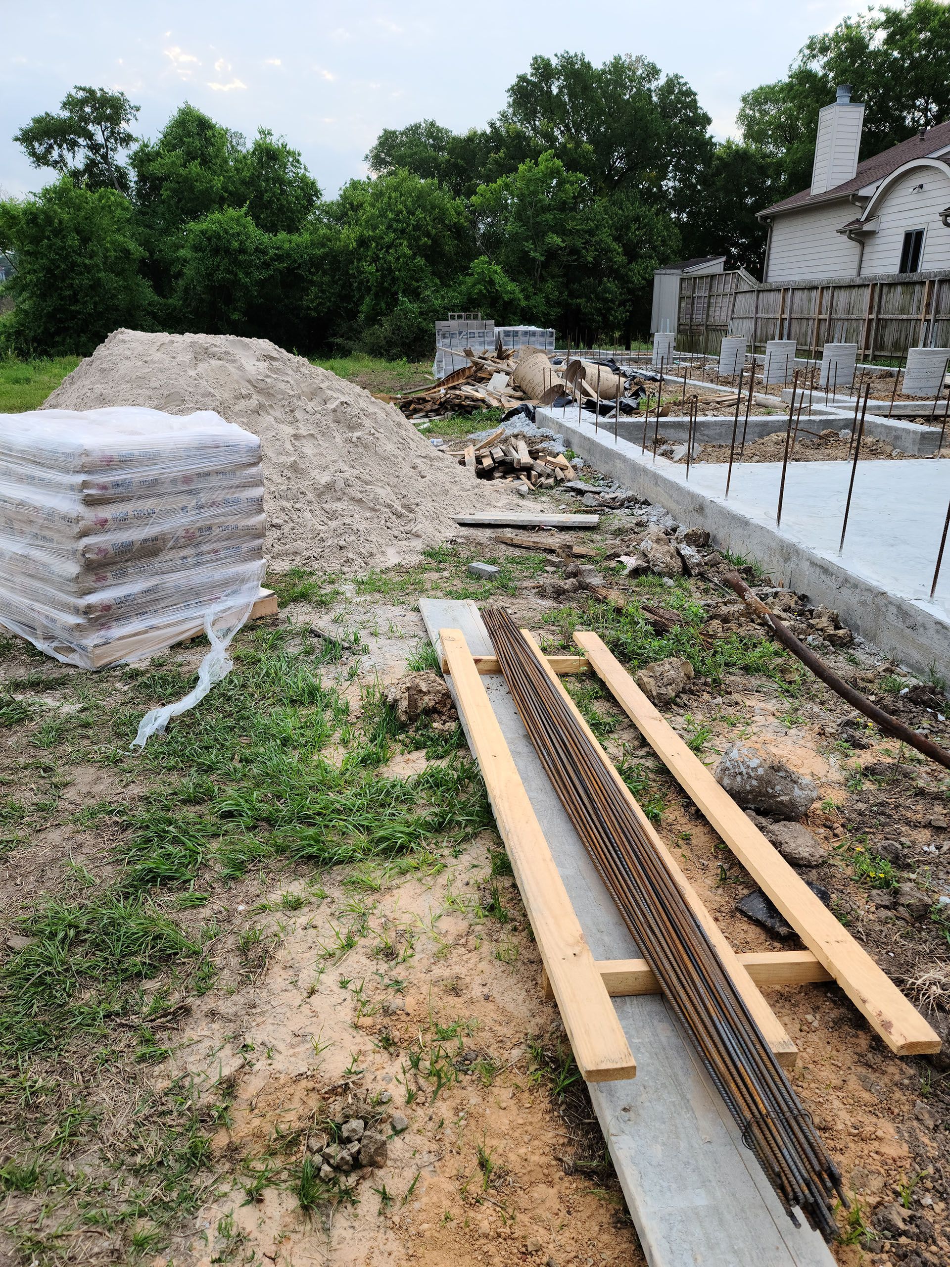 A construction site with a lot of wood and concrete.