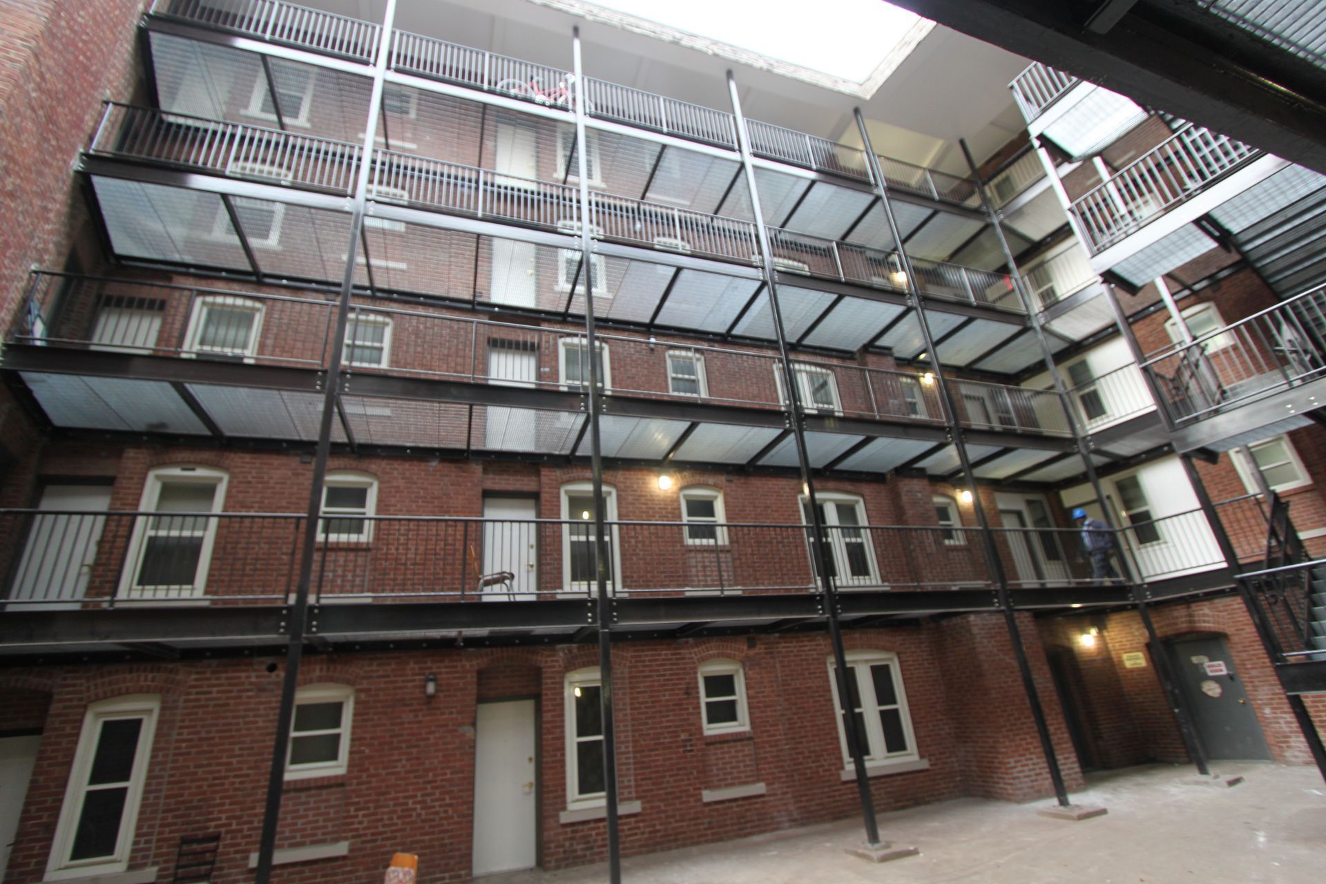 A large brick building with a lot of windows and balconies