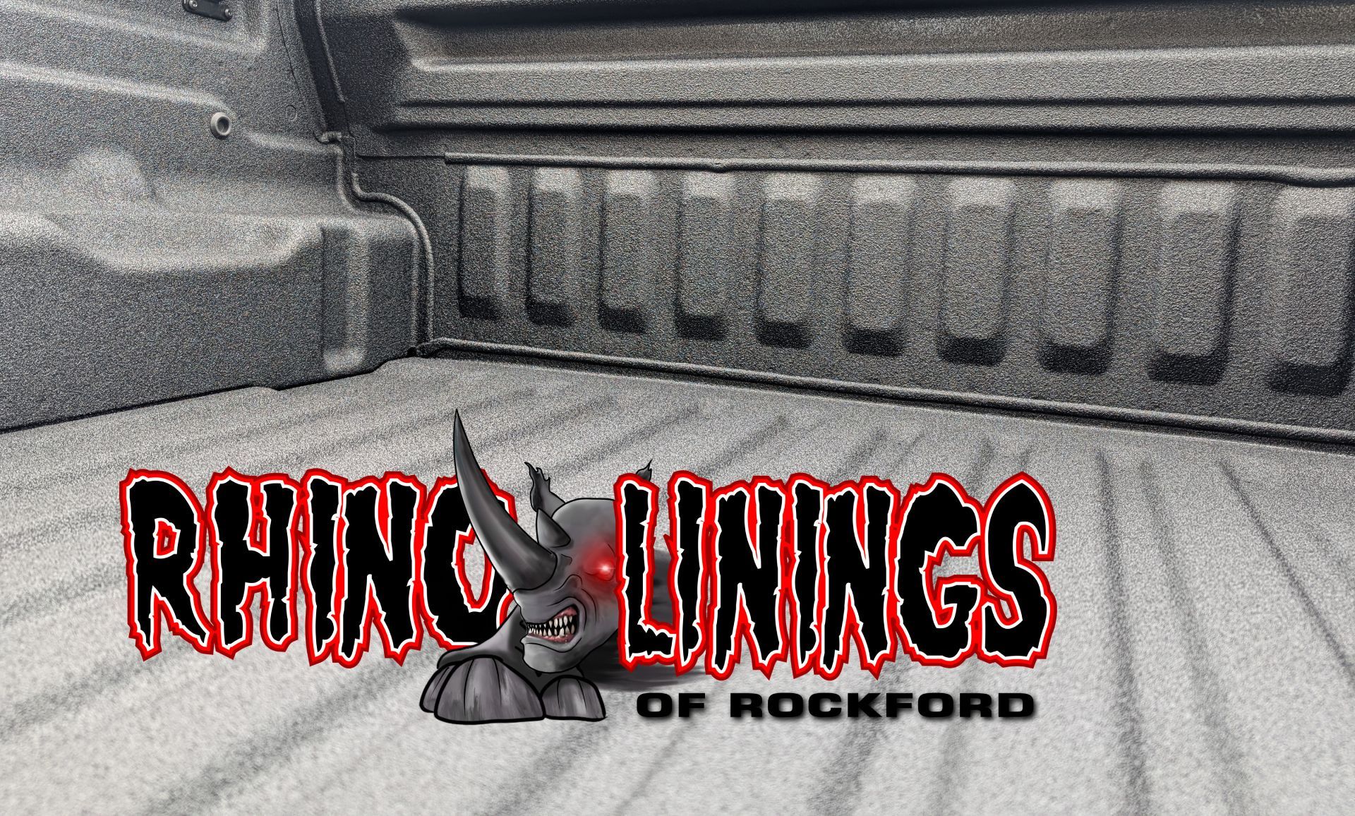 Rhino Linings logo in a truck bed