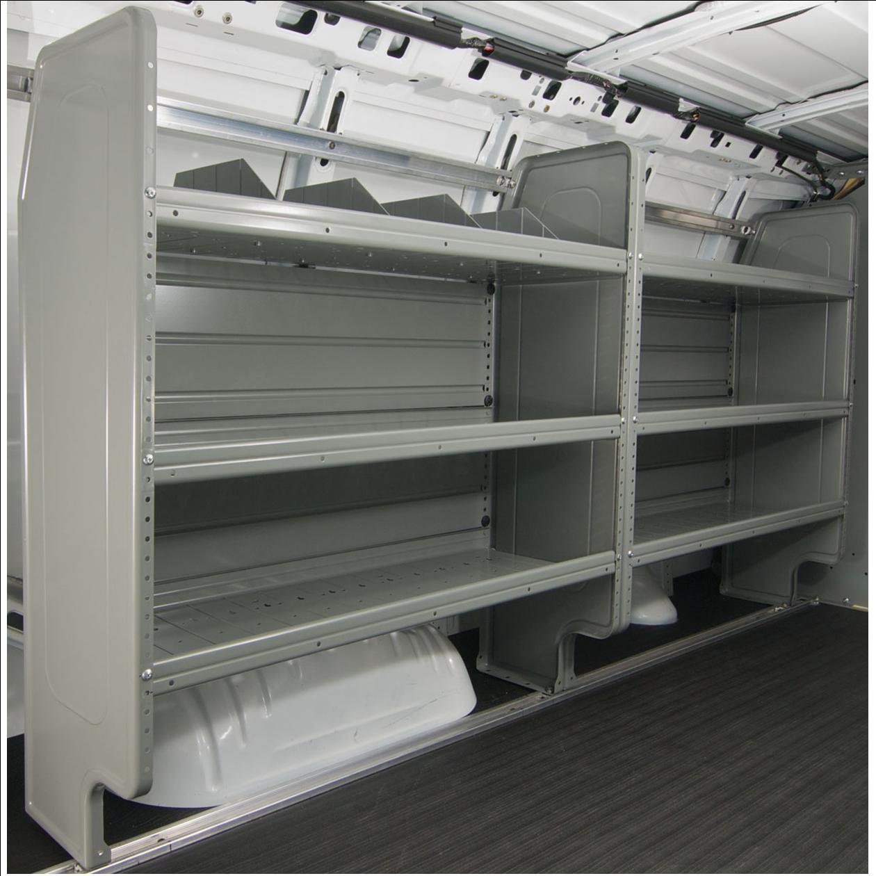 Gray shelving units installed inside a white van for storage and organization.