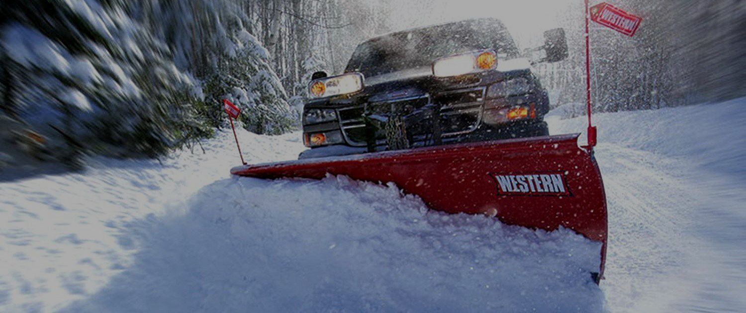 Snowplow clearing a snow-covered road