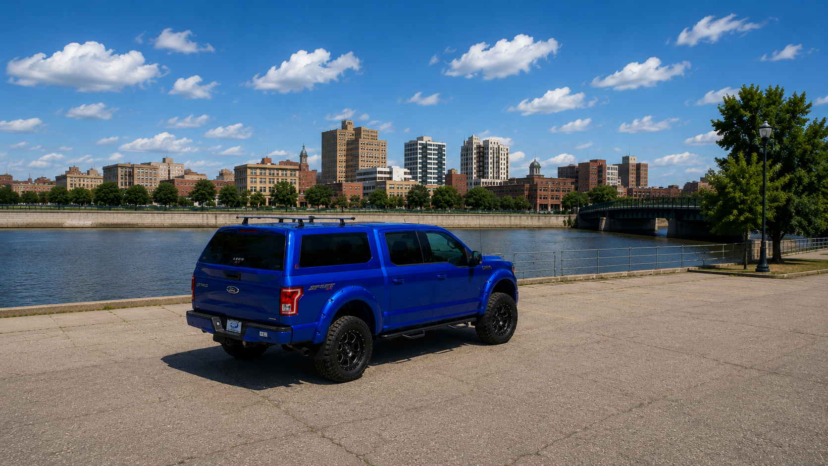 Blue Ford pickup truck with camper shell