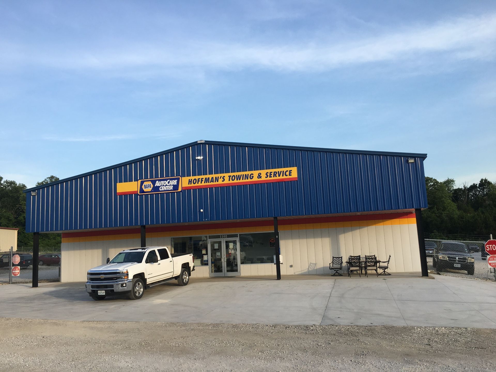 Blue and white building with sign
