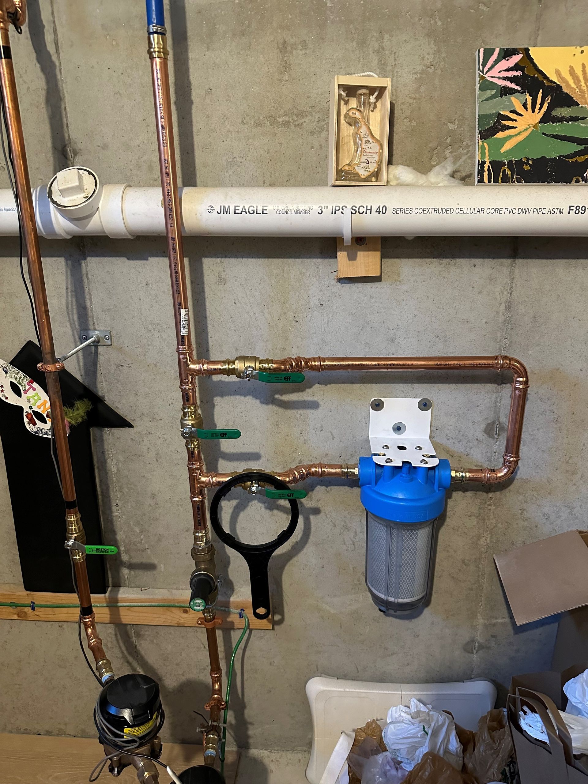 A copper pipe with a blue filter attached to it