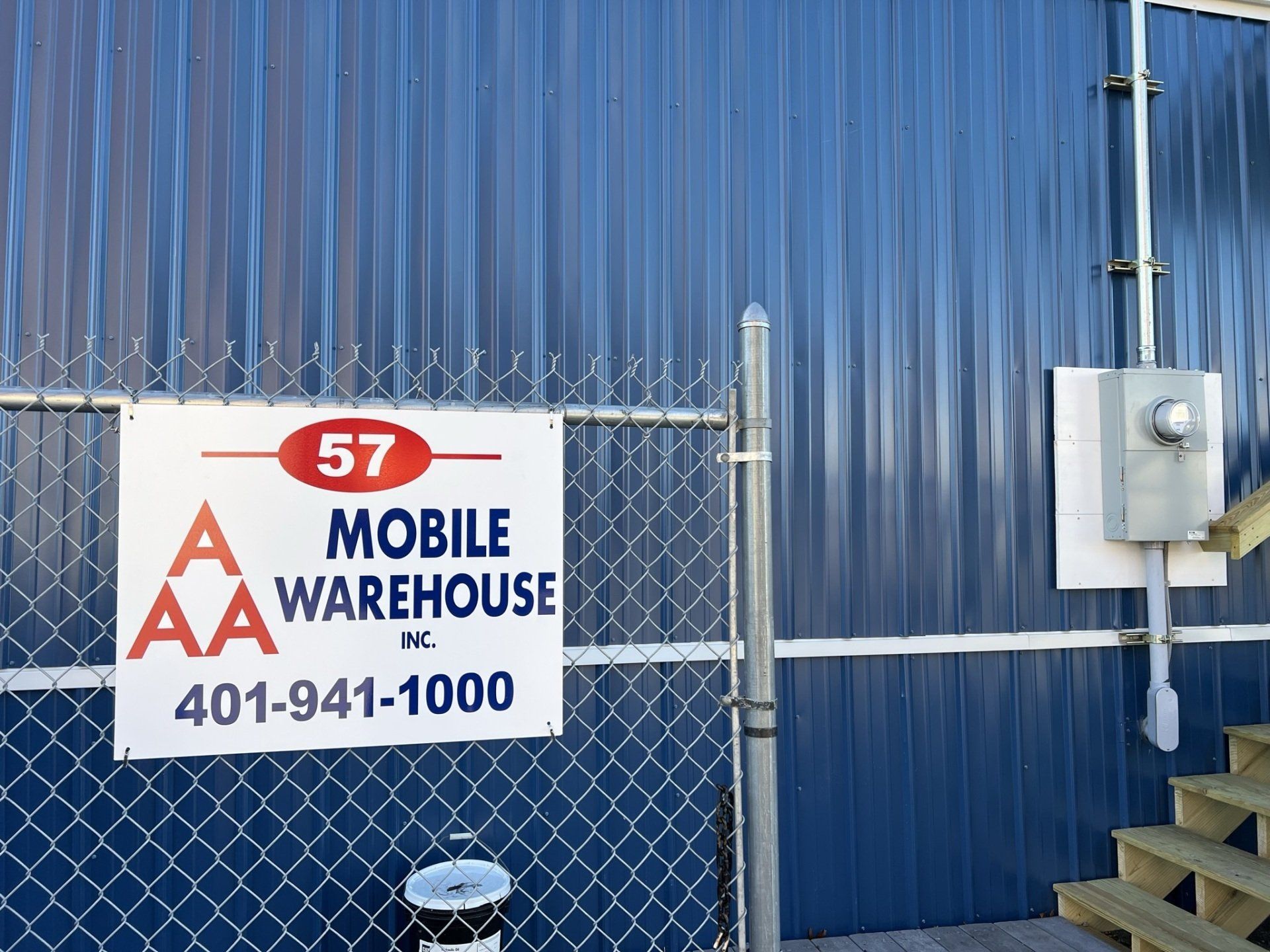 blue trailer and a sign
