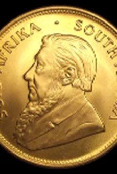A gold coin with a bearded man on it