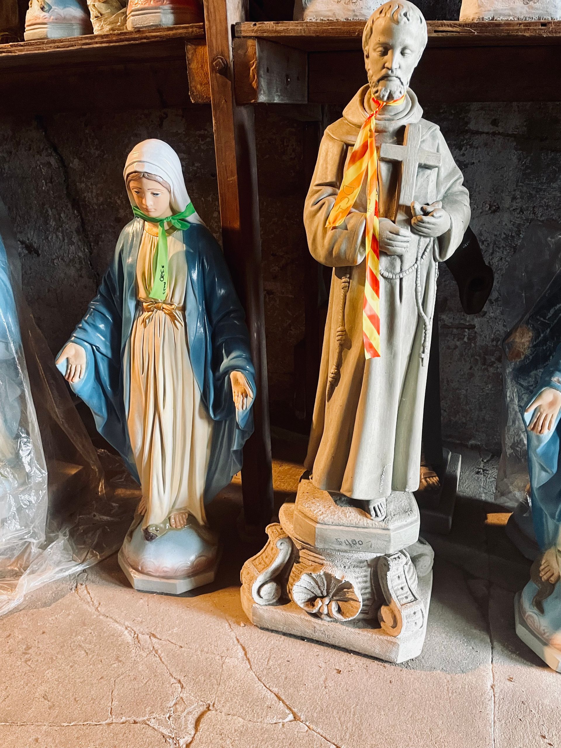 A statue of a man and a woman standing next to each other