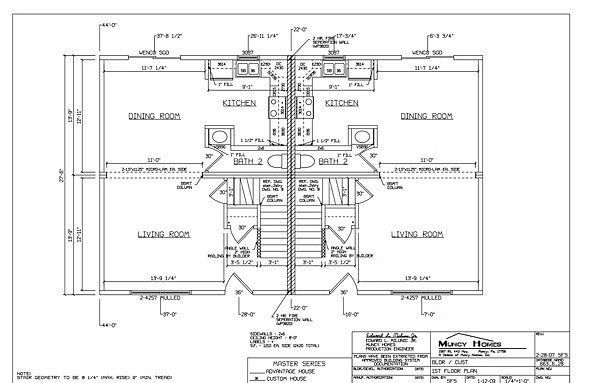 Architectural floor plan showing a duplex layout with two mirror-image units featuring a living room, kitchen, and stairs.