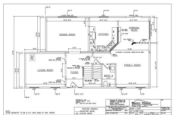 Architectural floor plan for the first floor of a residence, showing the layout of the kitchen, living room, and foyer.