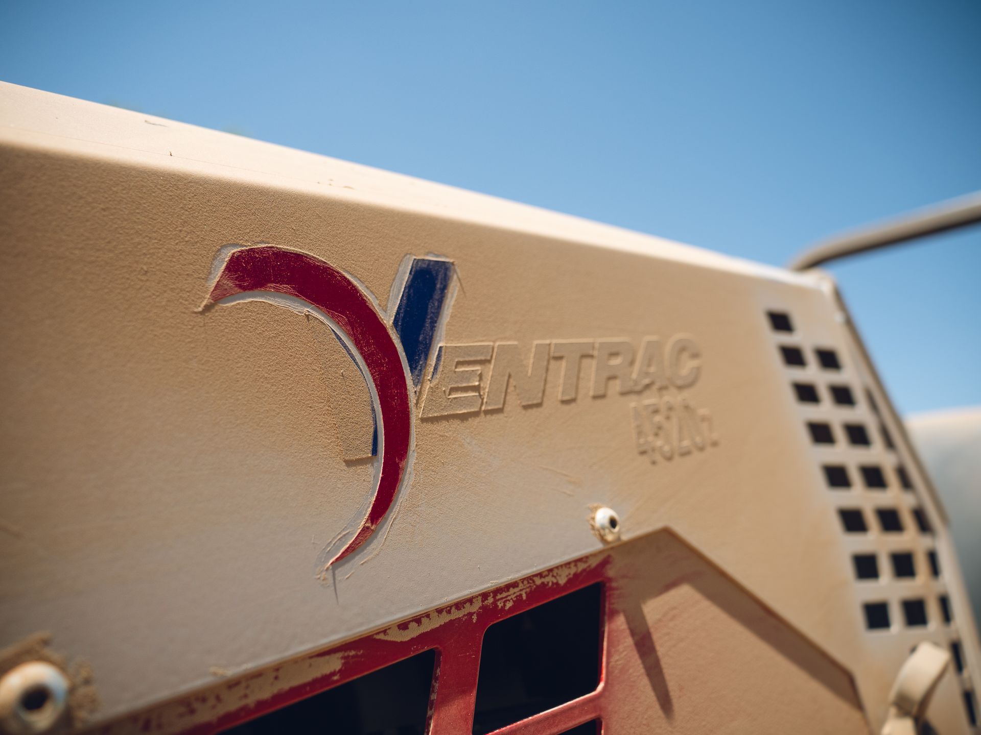 A close up of a ventpac logo on the side of a vehicle
