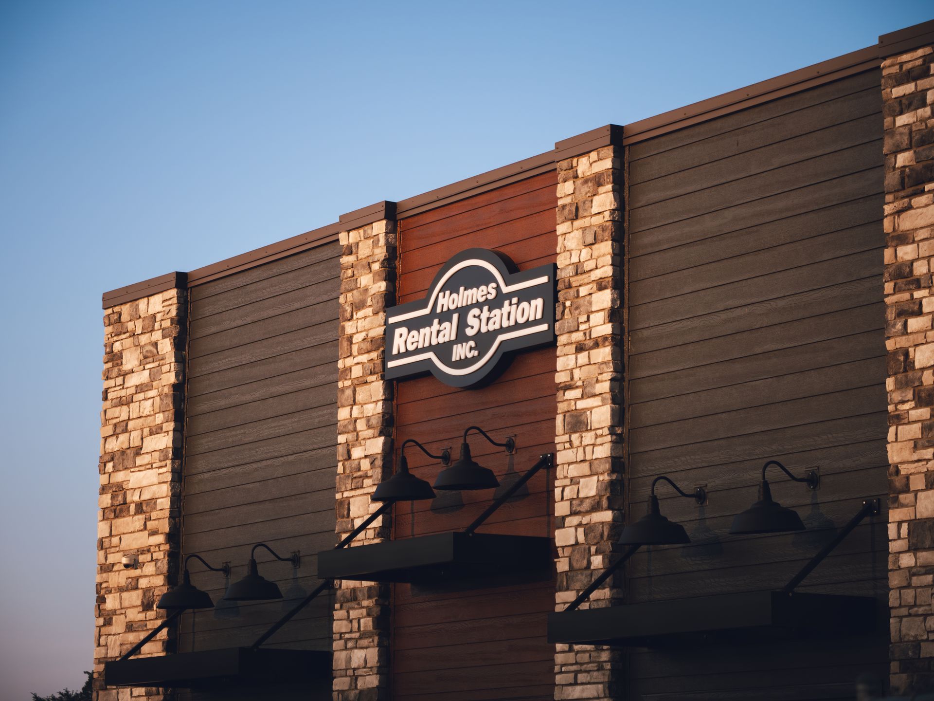 A building with a sign that says rental station on it