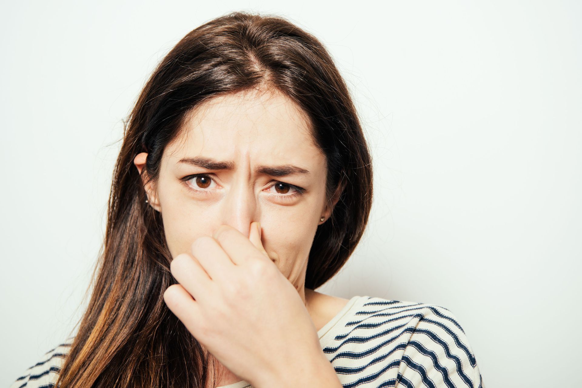 A room with a heater and a water heater in it.