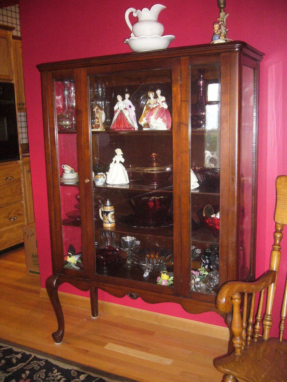 Antique cabinet with figurine display