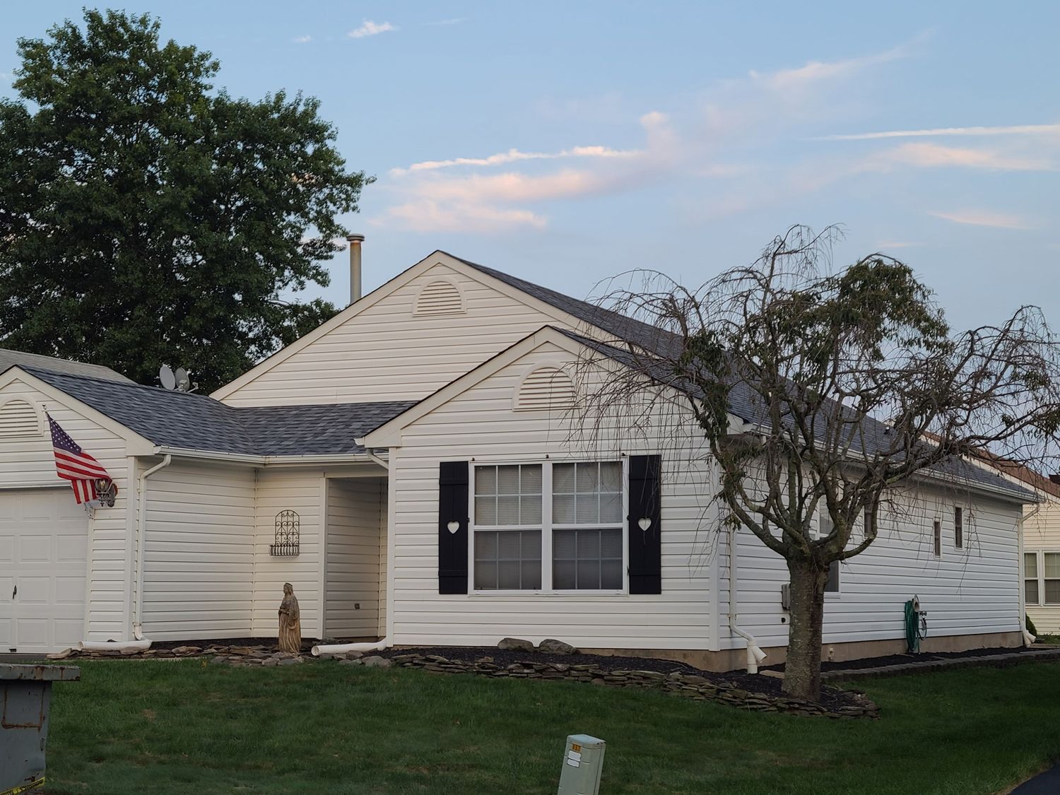 A white house with an american flag on the front of it