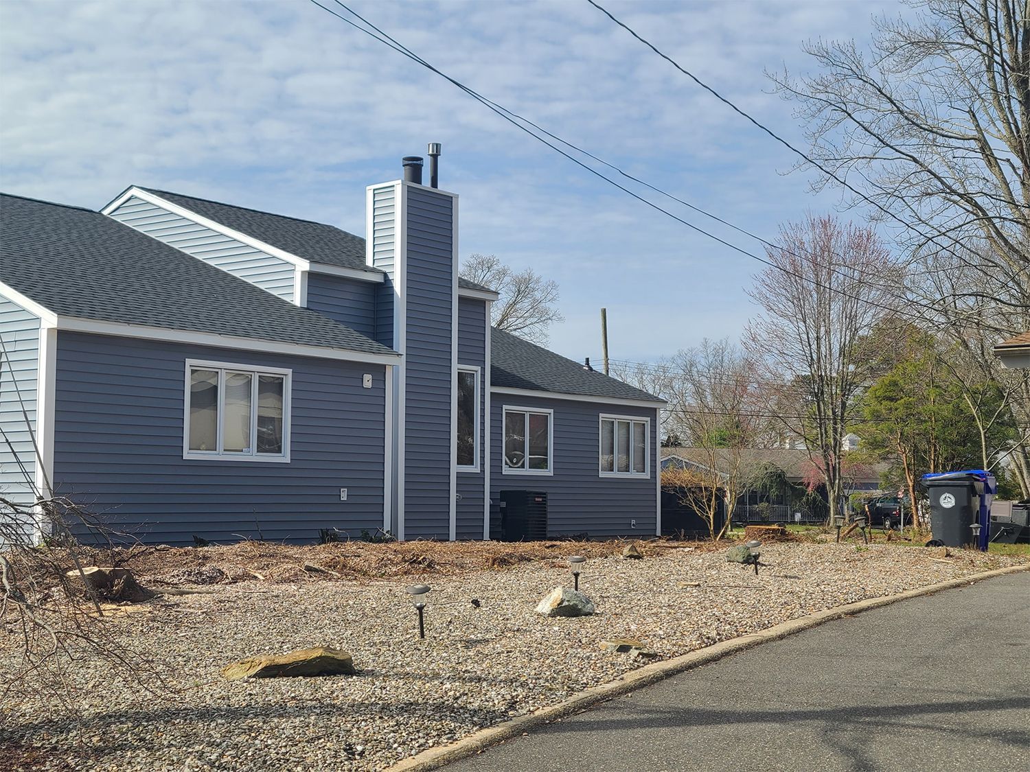 A house with a chimney on the side of it